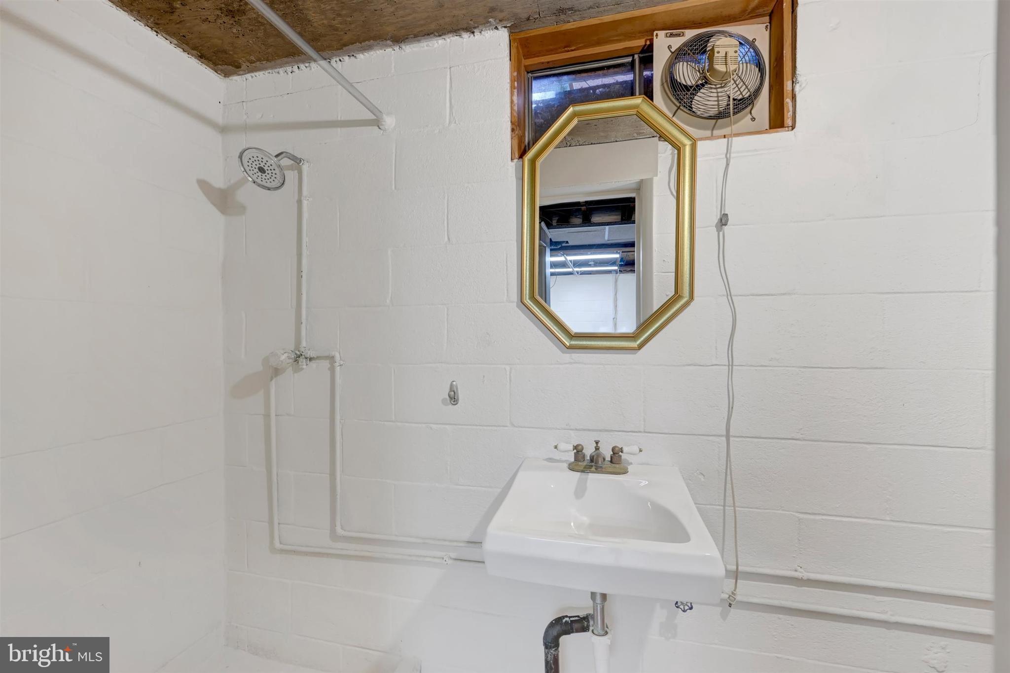 2926 Knoll Acres Drive Baltimore, MD 21234 - Photo 24 of 49 a bathroom with a sink and a mirror