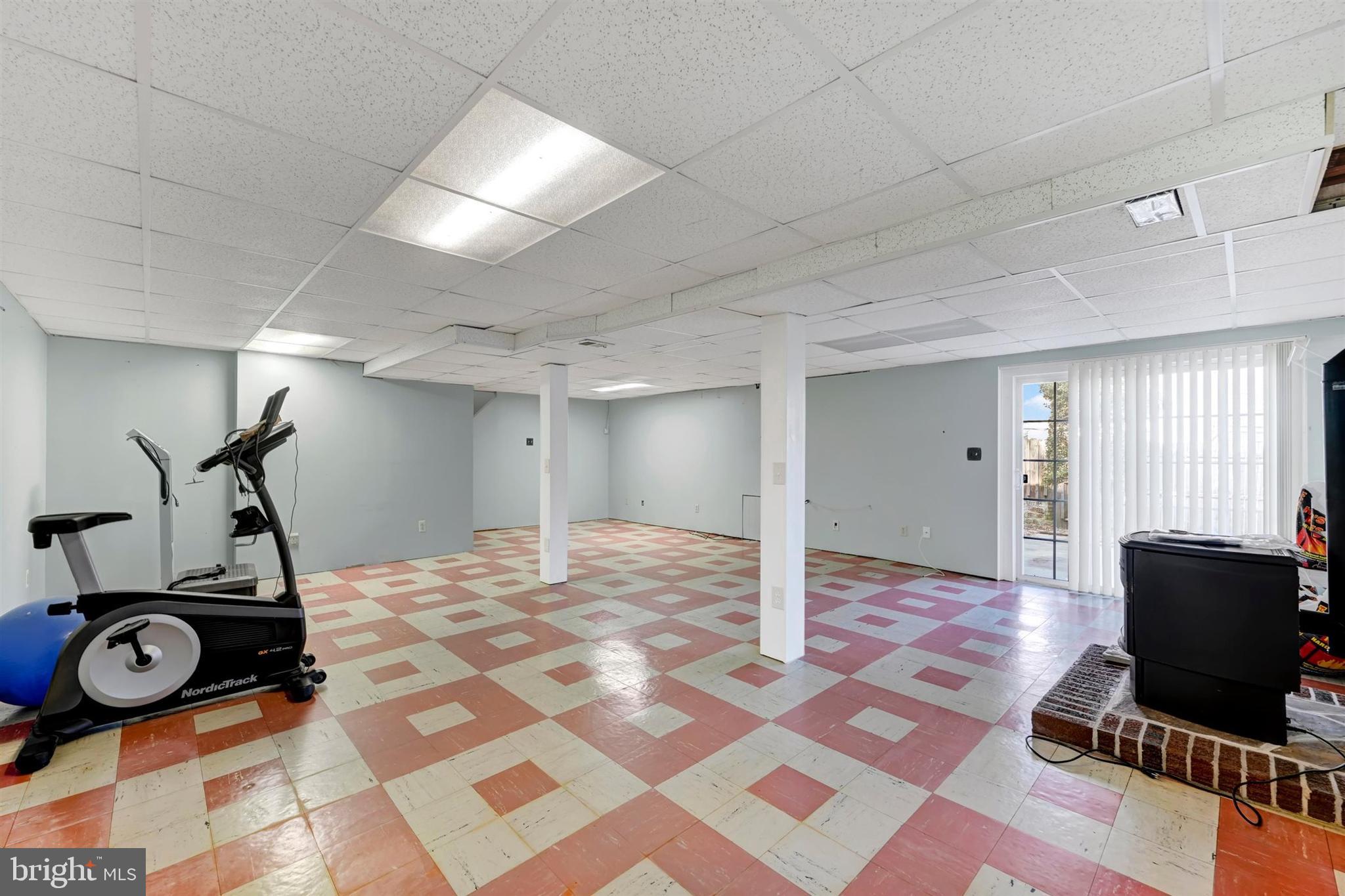 2926 Knoll Acres Drive Baltimore, MD 21234 - Photo 28 of 49 a view of a room with gym equipment and windows