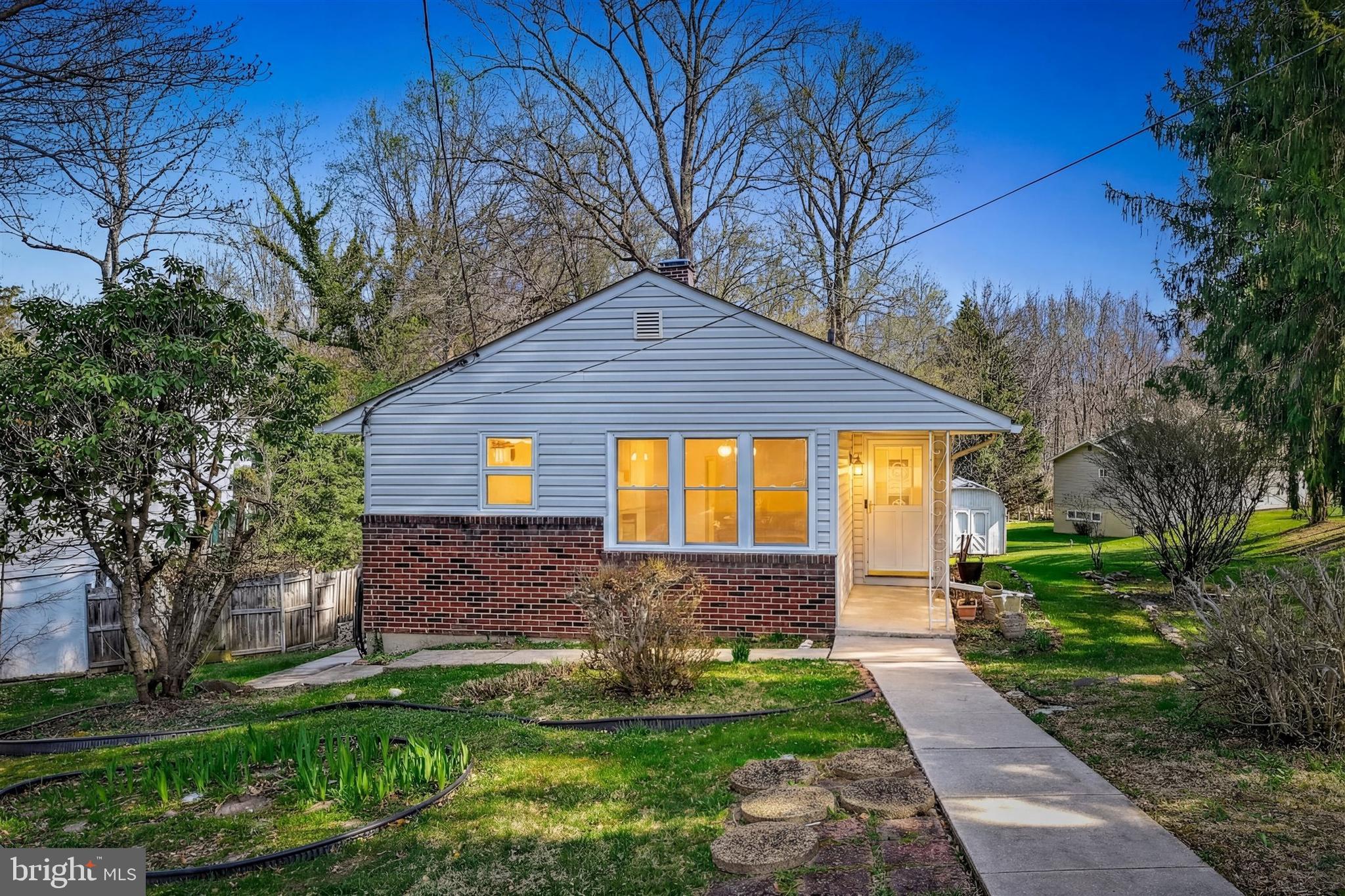 2926 Knoll Acres Drive Baltimore, MD 21234 - Photo 3 of 49 a front view of a house with a yard