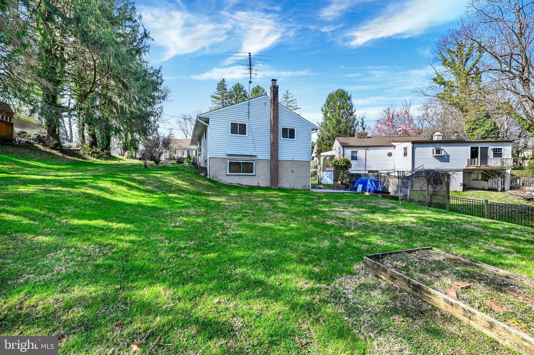 2926 Knoll Acres Drive Baltimore, MD 21234 - Photo 31 of 49 a view of a house with a big yard and large trees