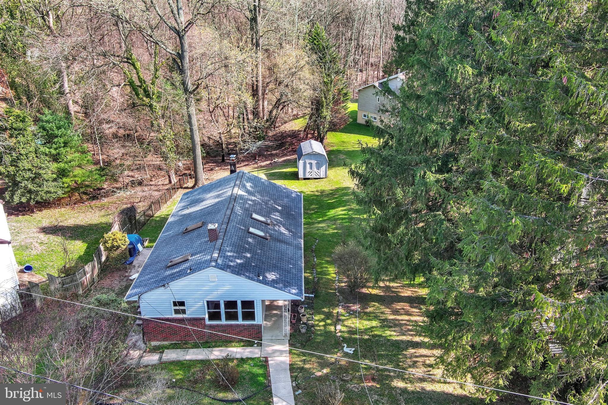 2926 Knoll Acres Drive Baltimore, MD 21234 - Photo 36 of 49 a view of a house with a yard