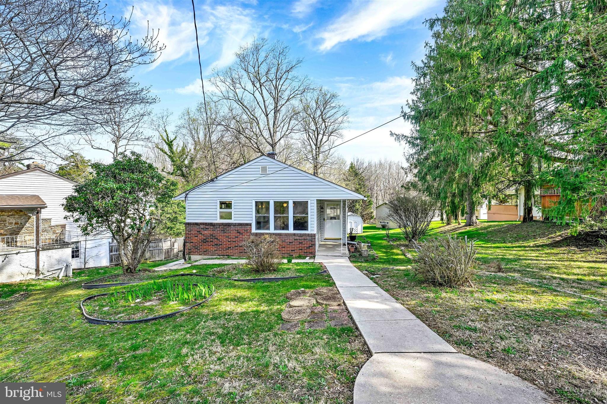 2926 Knoll Acres Drive Baltimore, MD 21234 - Photo 46 of 49 a front view of a house with garden