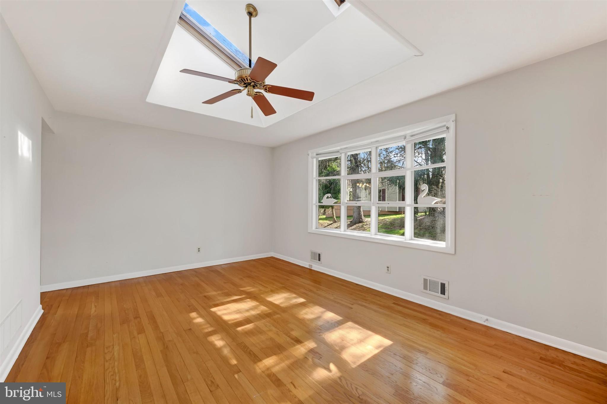 2926 Knoll Acres Drive Baltimore, MD 21234 - Photo 5 of 49 an empty room with a window and ceiling fan