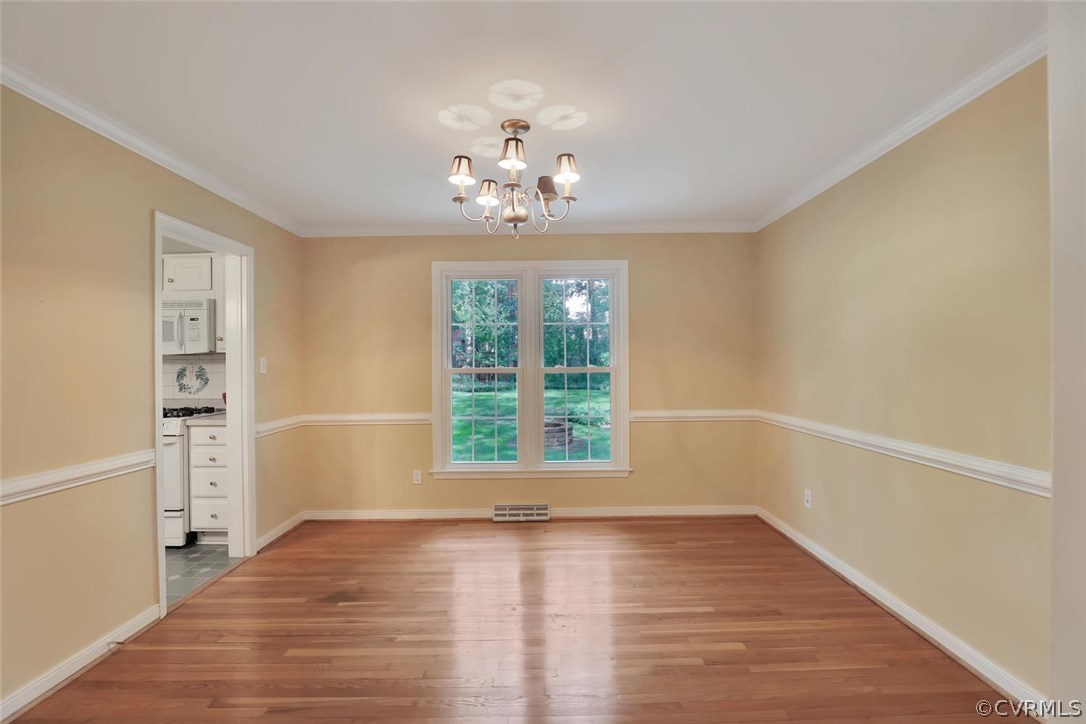 1607 Robindale Road North Chesterfield, VA 23235 - Photo 6 of 29 Formal dining room has hardwood floors and double