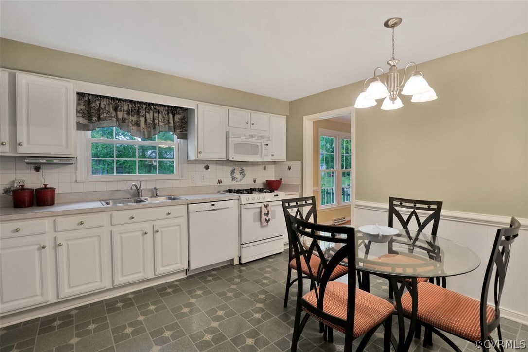 1607 Robindale Road North Chesterfield, VA 23235 - Photo 8 of 29 The kitchen has white cabinets and appliances with