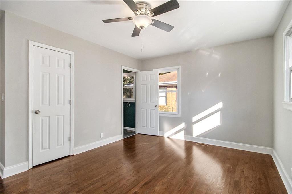 1723 Capistrana Place Decatur, GA 30032 - Photo 11 of 28 a view of an empty room with window and wooden floor