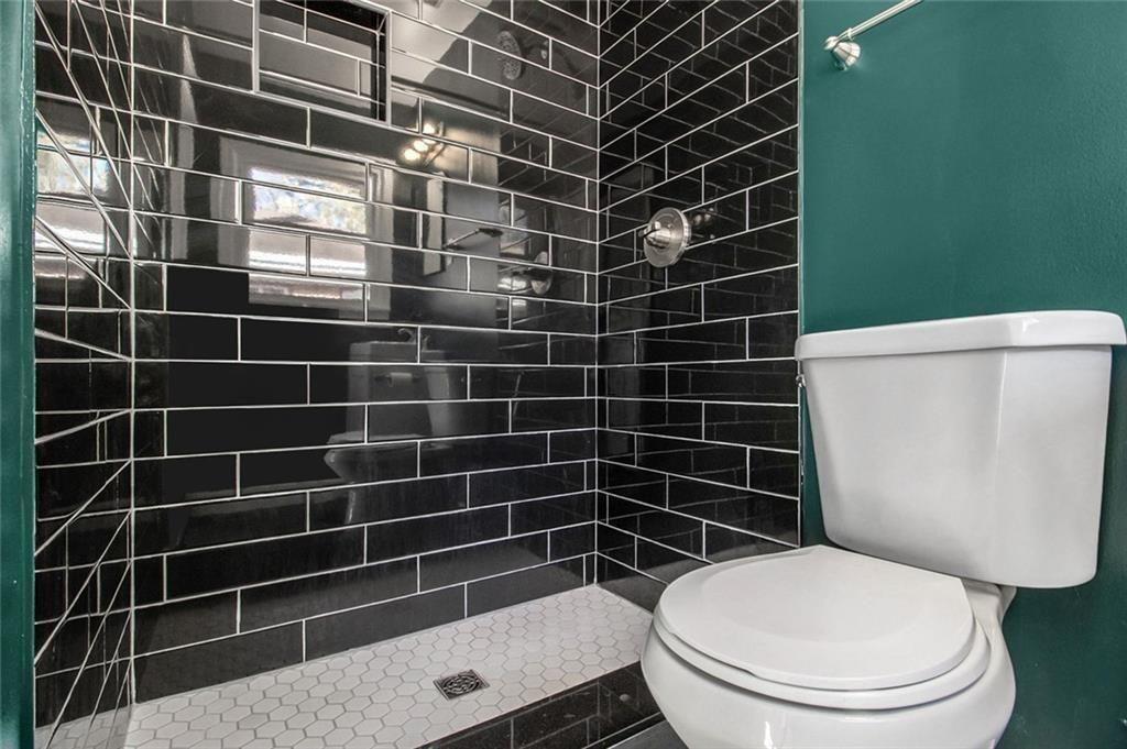 1723 Capistrana Place Decatur, GA 30032 - Photo 13 of 28 a toilet sitting next to a bathroom sink