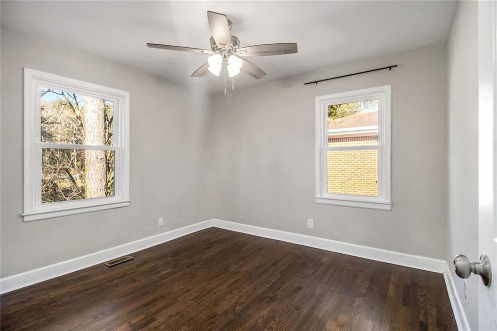 1723 Capistrana Place Decatur, GA 30032 - Photo 15 of 28 a view of an empty room with wooden floor and a window