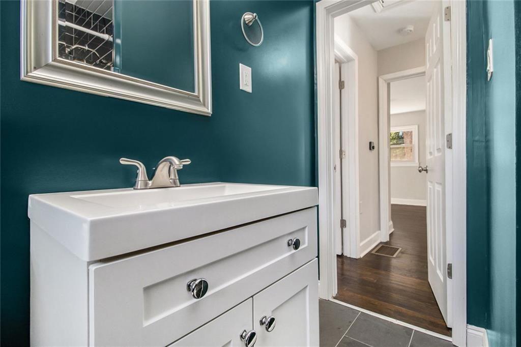 1723 Capistrana Place Decatur, GA 30032 - Photo 16 of 28 a bathroom with a sink and a mirror