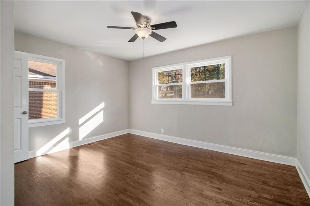 1723 Capistrana Place Decatur, GA 30032 - Photo 17 of 28 a view of an empty room with wooden floor and a window