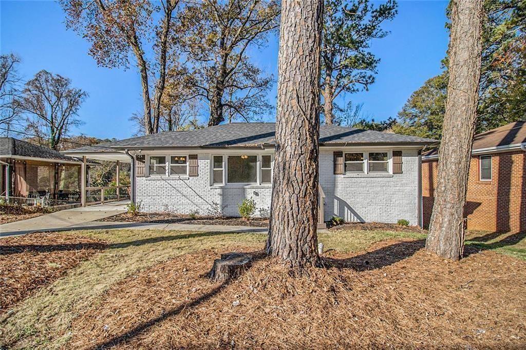 1723 Capistrana Place Decatur, GA 30032 - Photo 4 of 28 a view of a house with a small yard and large tree