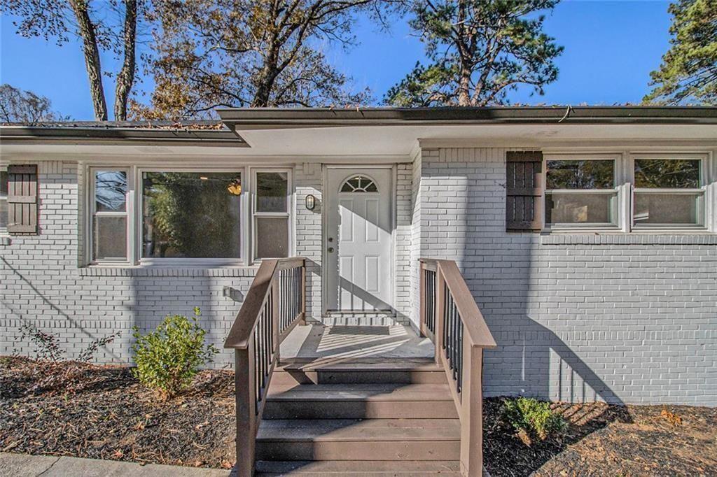 1723 Capistrana Place Decatur, GA 30032 - Photo 6 of 28 a view of a house with a window and flower plants