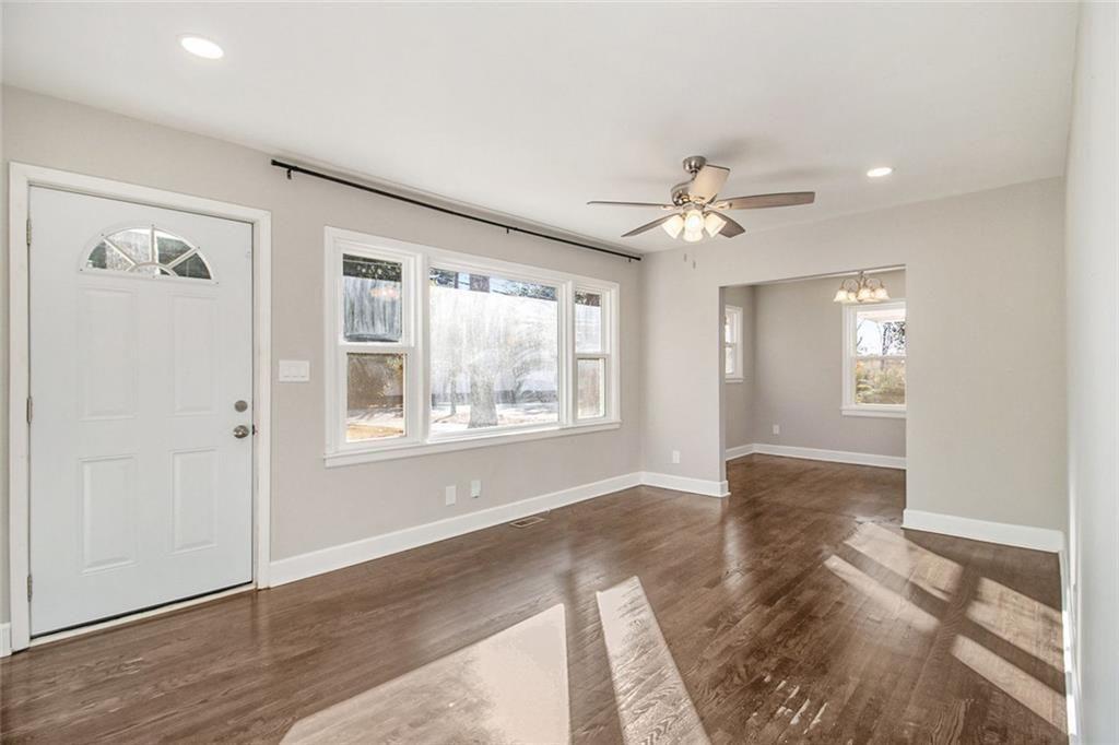 1723 Capistrana Place Decatur, GA 30032 - Photo 7 of 28 wooden floor in an empty room with a window