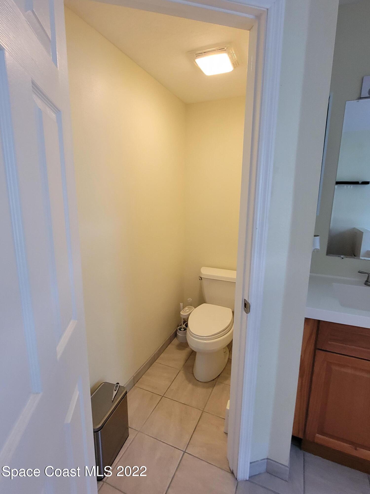 1435 Madison Road Northwest Palm Bay, FL 32907 - Photo 10 of 14 Private toilet area with door