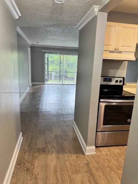 Coral Ridge Isles Fort Lauderdale, FL 33334 - Photo 1 of 17 a kitchen with a stove wooden floor and a window