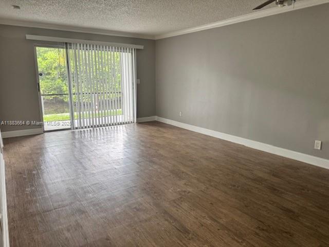 Coral Ridge Isles Fort Lauderdale, FL 33334 - Photo 2 of 17 a view of an empty room with wooden floor and a window