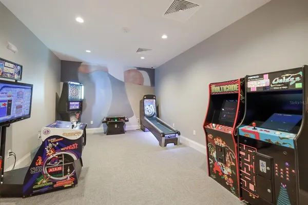a living room with furniture a window and a flat screen tv