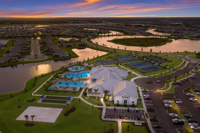 an aerial view of a pool patio swimming pool and outdoor seating