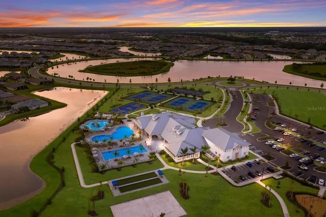 an aerial view of a swimming pool patio and outdoor seating