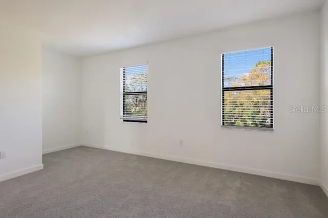 an empty room with windows