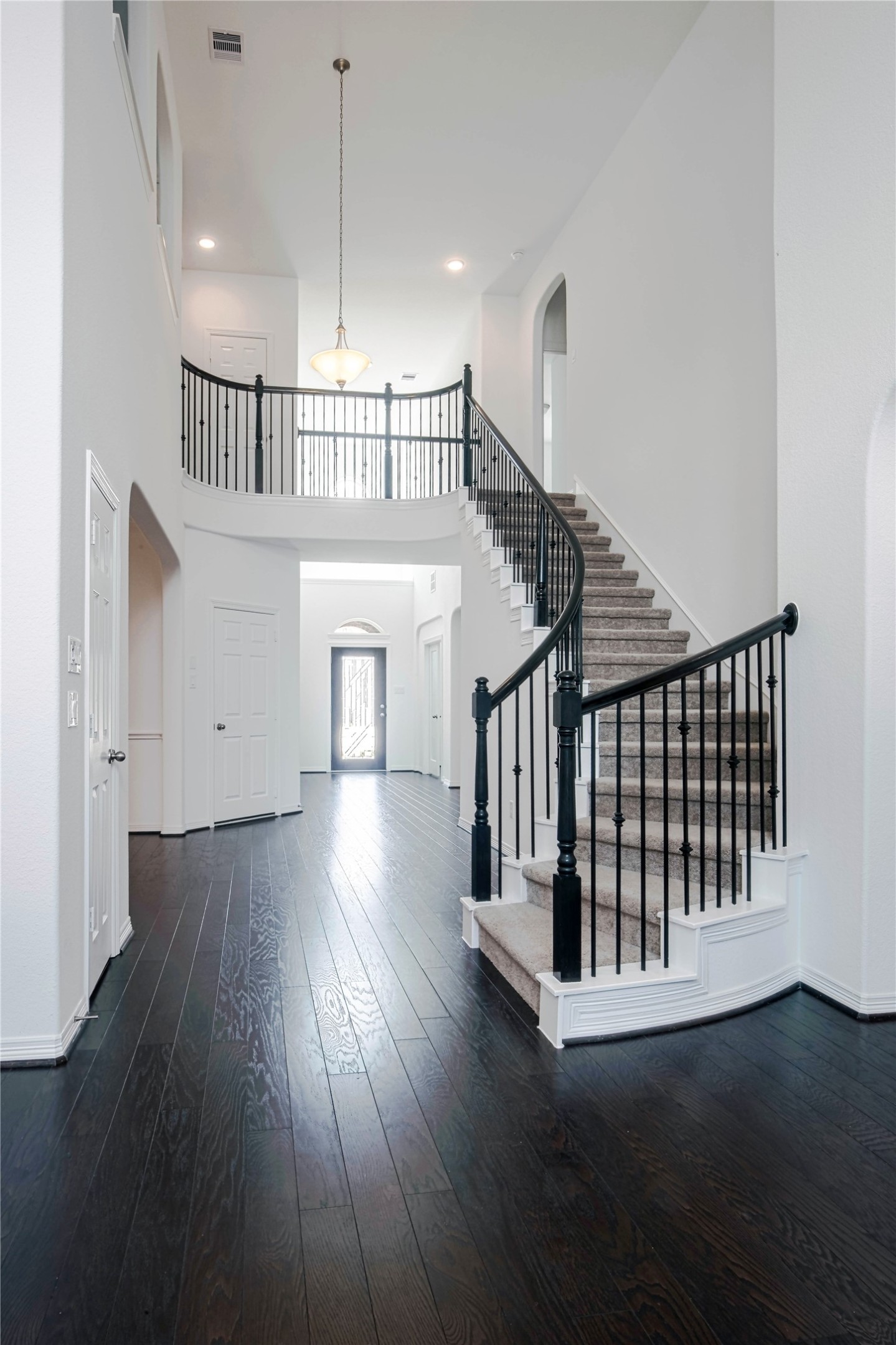6307 Grand Drift Court Katy, TX 77494 - Photo 3 of 24 Beautiful hard wood floor with iron staircase.