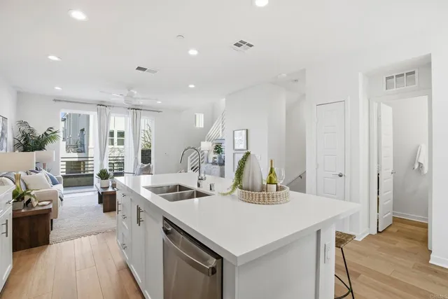 a bathroom with a shower sink and mirror