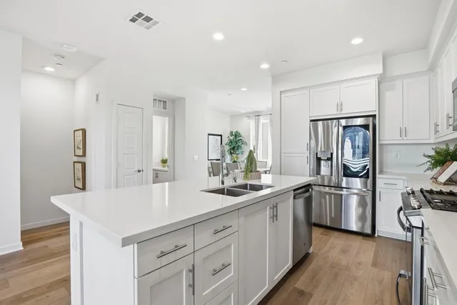a view of a storage and utility room with washer and dryer