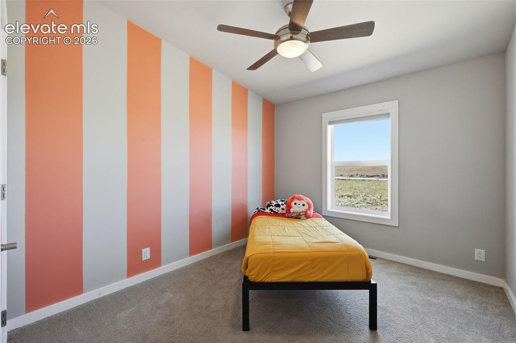 23335 Sanborn Road Calhan, CO 80808 - Photo 16 of 28 Additional main level bedroom with natural light and open views