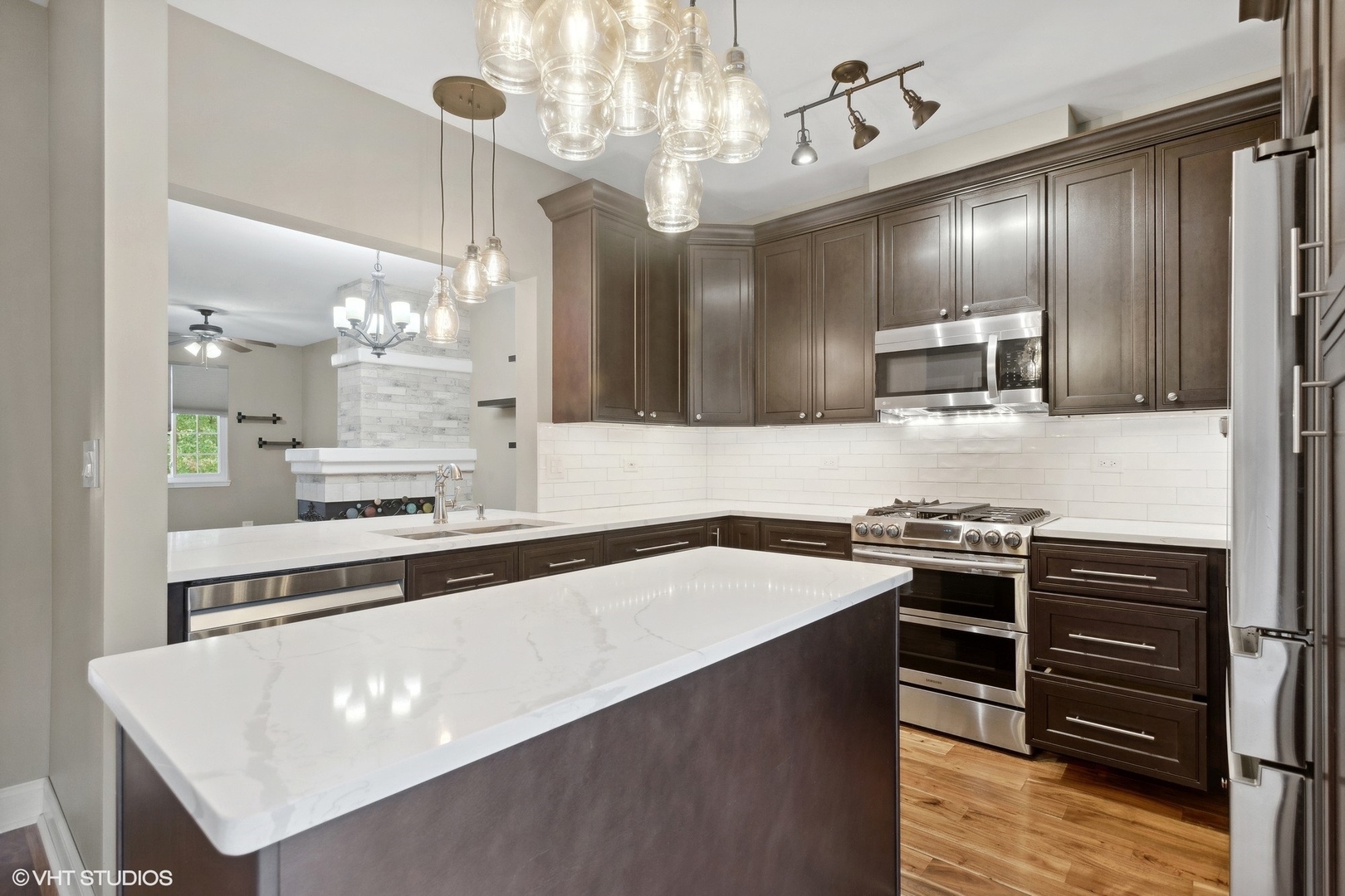 3443 Ravinia Circle Aurora, IL 60504 - Photo 10 of 36 a kitchen with stainless steel appliances a stove refrigerator and cabinets