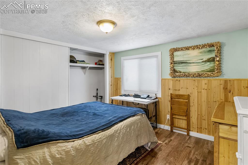 358 Fern Road Woodland Park, CO 80863 - Photo 11 of 17 a bedroom with a bed and furniture