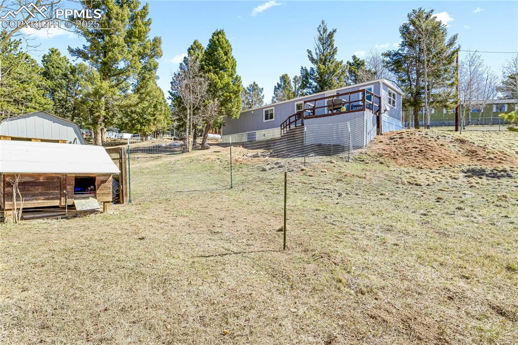 358 Fern Road Woodland Park, CO 80863 - Photo 14 of 17 a house with trees in the background