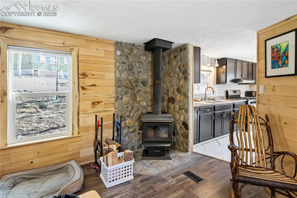 358 Fern Road Woodland Park, CO 80863 - Photo 4 of 17 a living room with furniture and a floor to ceiling window
