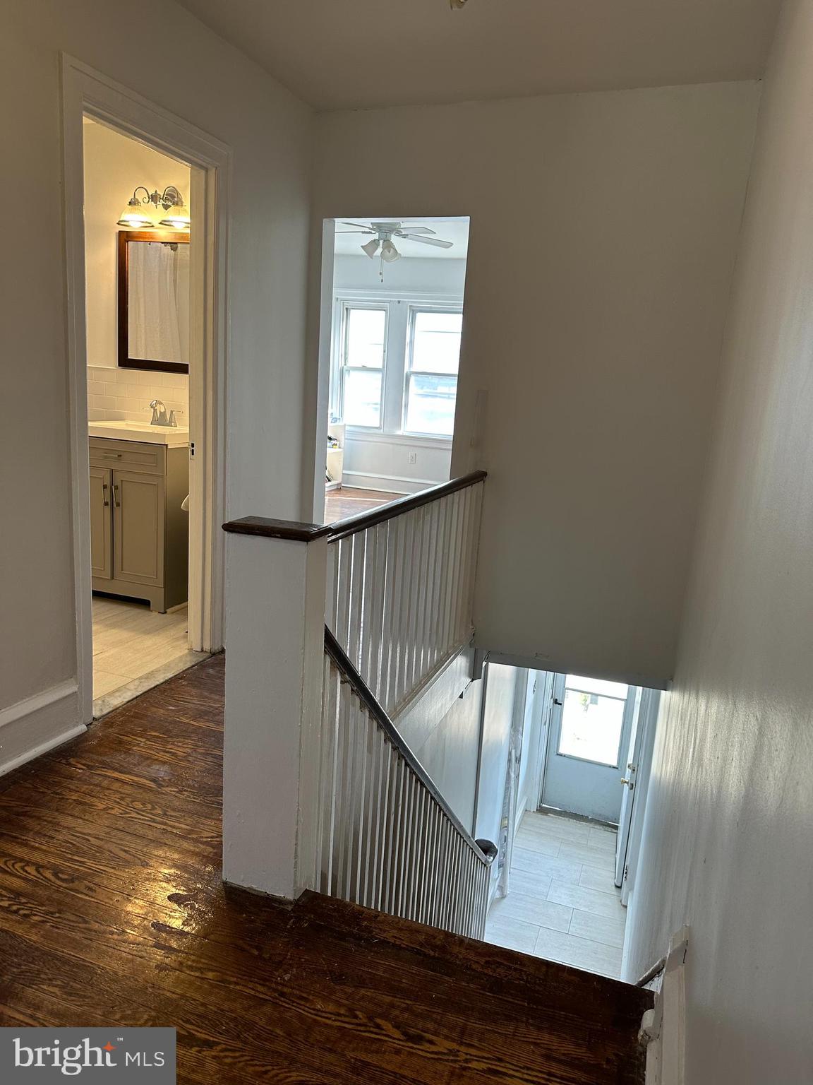 5928 Loretto Avenue Philadelphia, PA 19149 - Photo 4 of 9 a view of a hallway with wooden floor and a bathroom