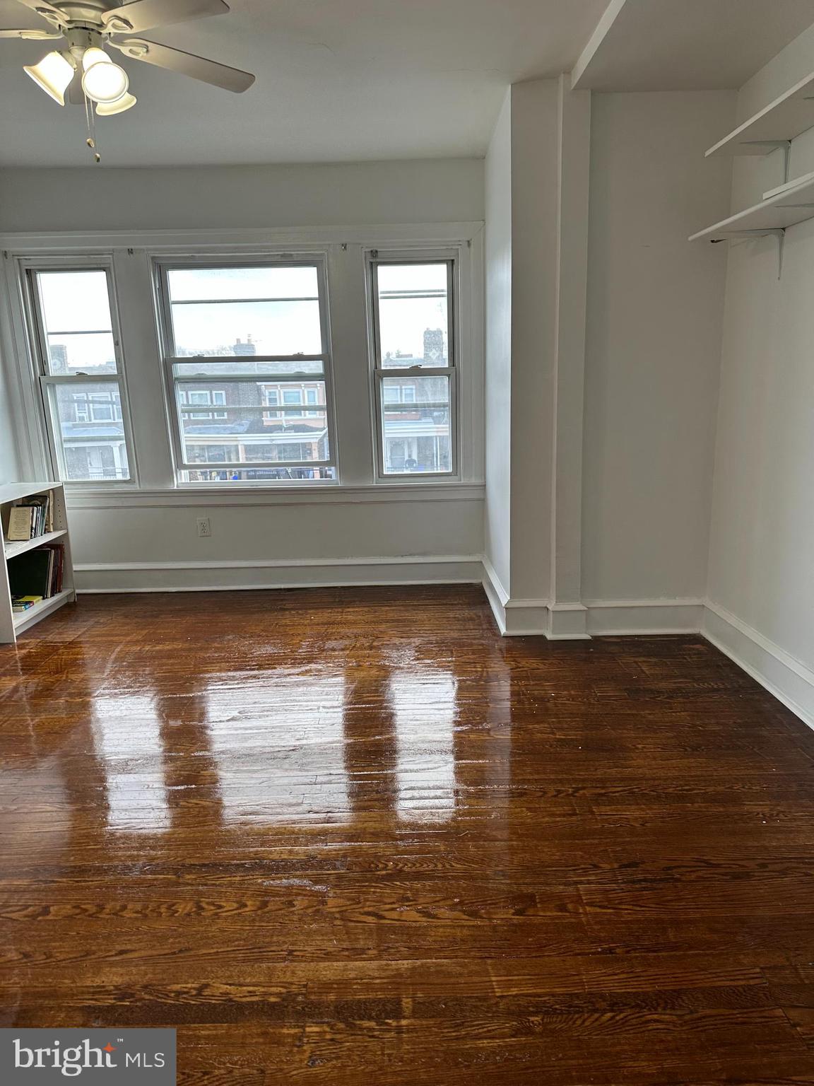 5928 Loretto Avenue Philadelphia, PA 19149 - Photo 5 of 9 a view of empty room with wooden floor and fan