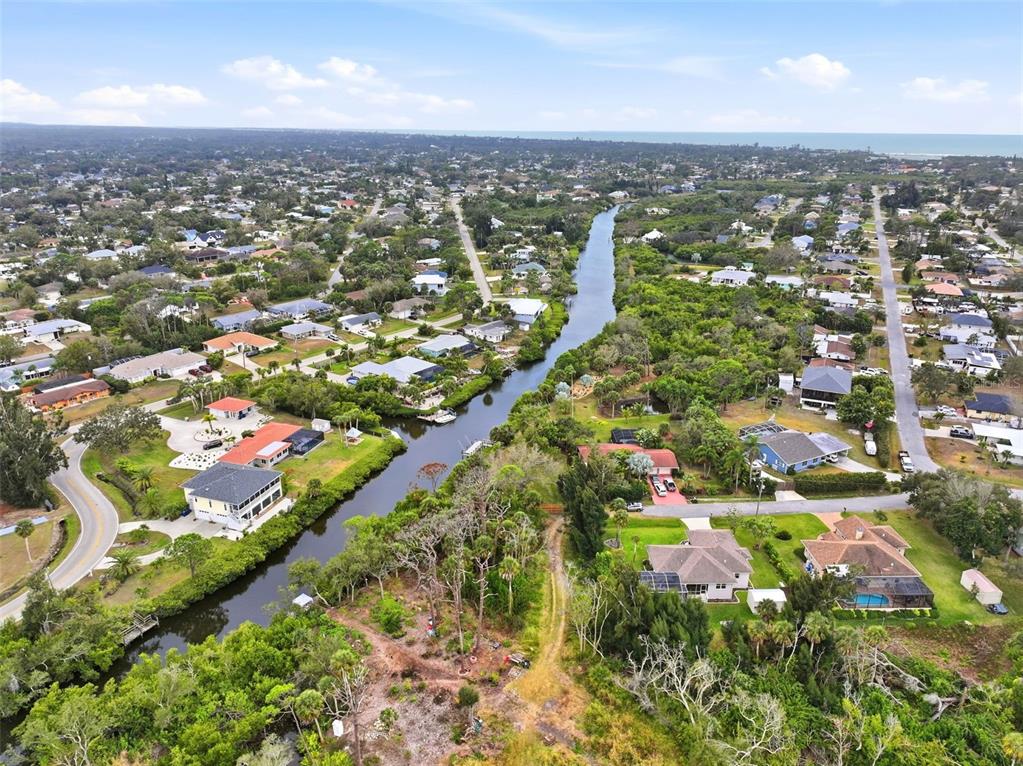 0 Dunbar Road Venice, FL 34293 - Photo 6 of 7 an aerial view of residential houses with outdoor space and trees