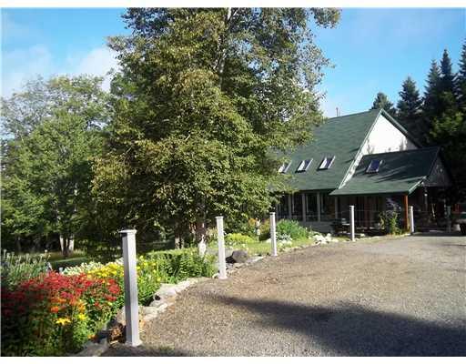 247 Mingo Loop Road Rangeley, ME 04970 - Photo 27 of 34 Exterior Front. Well landscaped...