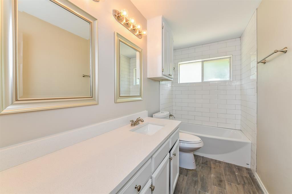 1772 Independence Road Blue Mound, TX 76131 - Photo 14 of 16 a bathroom with a sink a toilet and shower