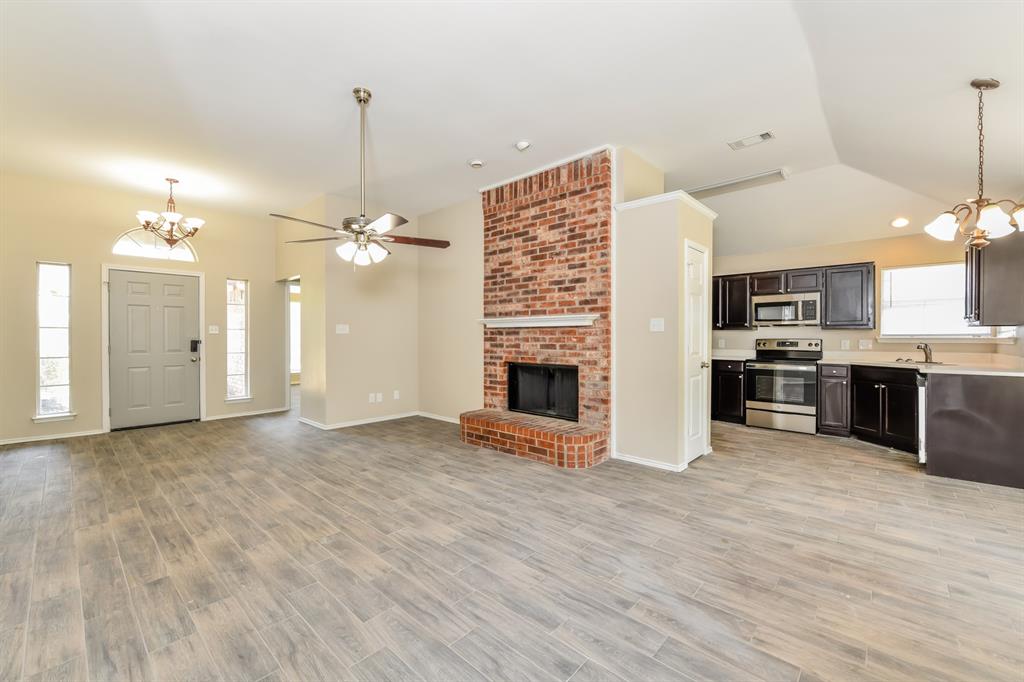 1772 Independence Road Blue Mound, TX 76131 - Photo 2 of 16 a view of a kitchen with a sink and a kitchen counter top