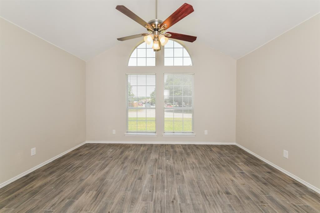 1772 Independence Road Blue Mound, TX 76131 - Photo 8 of 16 an empty room with wooden floor and windows