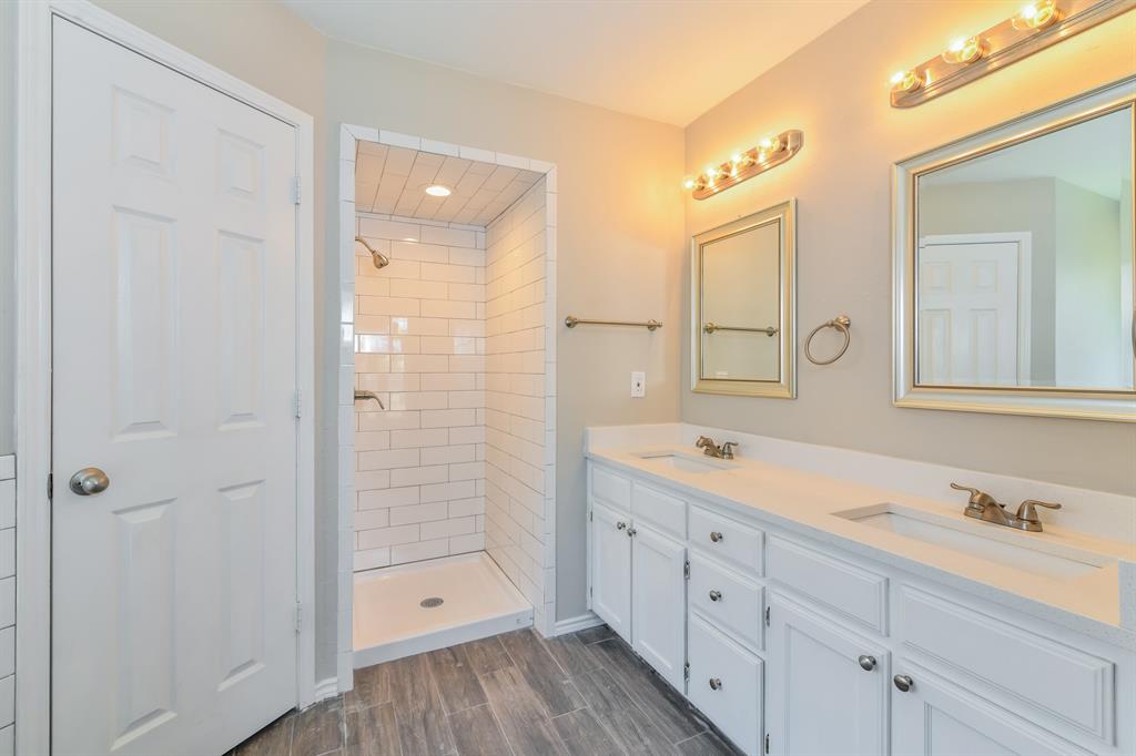1772 Independence Road Blue Mound, TX 76131 - Photo 10 of 16 a spacious bathroom with a shower a sink and a mirror