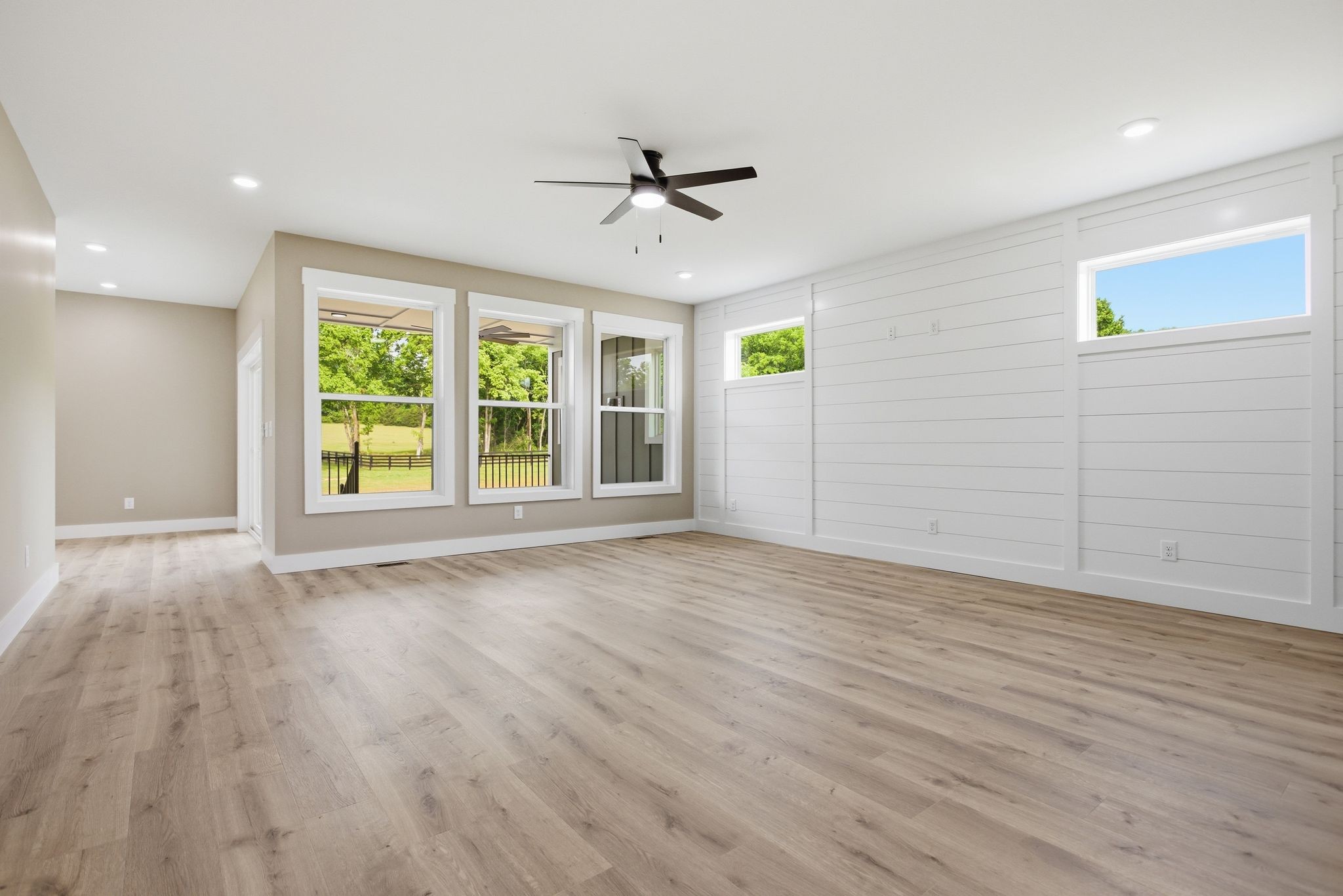 3319 Booker Ridge Road Mount Pleasant, TN 38474 - Photo 16 of 51 an empty room with wooden floor and windows