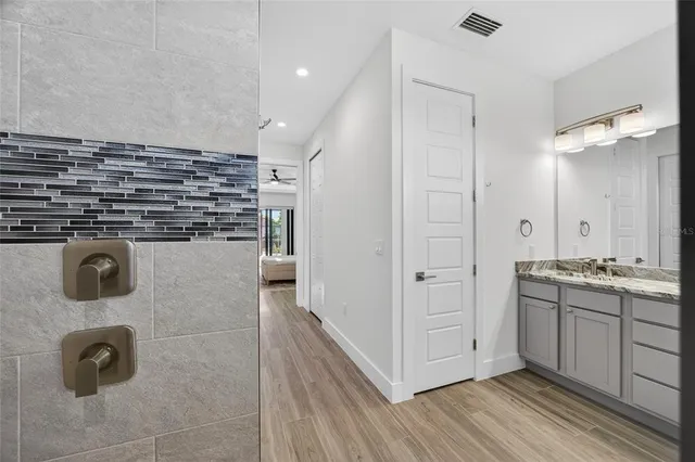 a kitchen with stainless steel appliances granite countertop a stove and a refrigerator