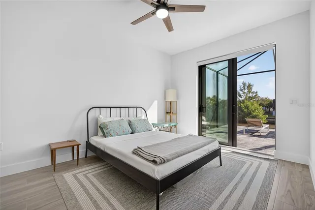 a bedroom with a bed lamp and window