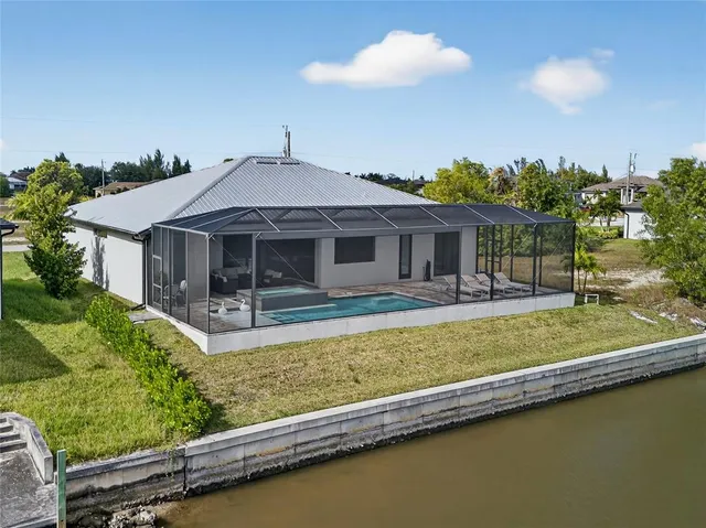 an aerial view of a house with a big yard