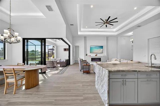 a view of living room with granite countertop furniture and a chandelier