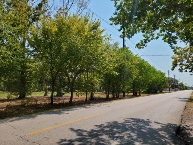 a view of road with trees