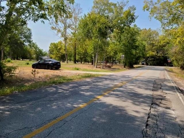 803 West Archer Road Baytown, TX 77521 - Photo 4 of 5 a view of a yard with large trees