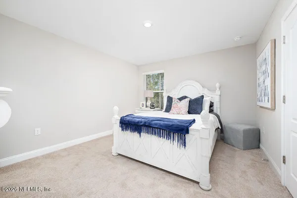 a bed room with a bed and a table