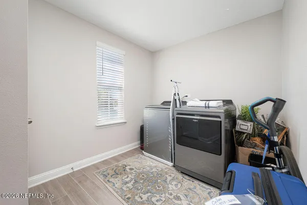 a view of workspace with furniture and window