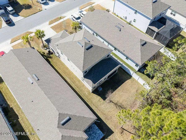 aerial view of a house with a yard